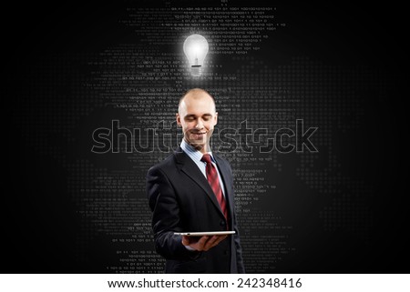 Young bald businessman with tablet pc against digital background