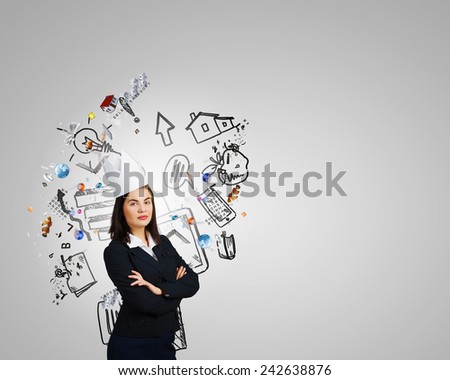 Young businesswoman in paper crown and speech balloon in hand