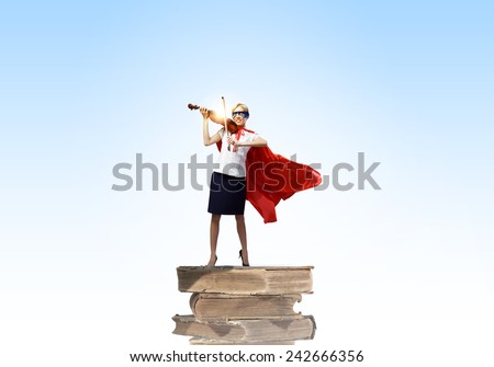 Young woman in super hero costume playing violin