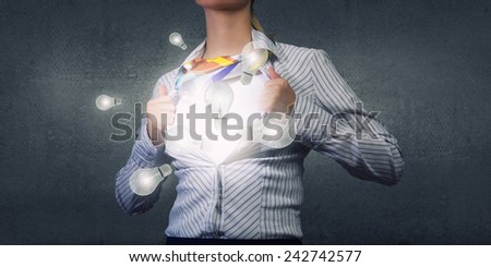Unrecognizable businesswoman opening her shirt like superhero