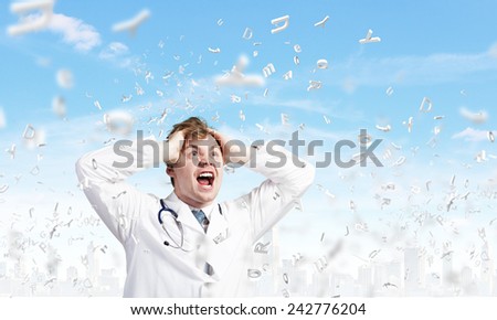 Young frustrated crazy doctor screaming very emotionally