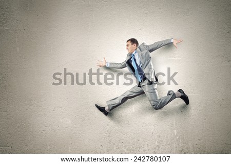 Funny image of businessman running in a hurry