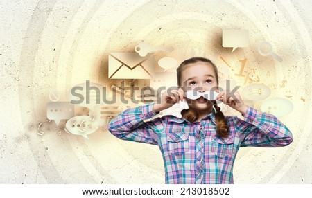 Cute girl wearing shirt and paper mustache
