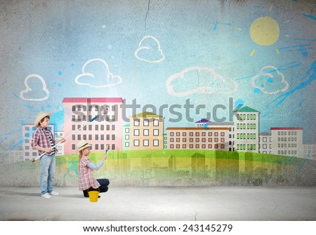 Two children of school age painting wall with roller