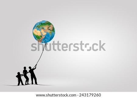 Silhouettes of people pulling Earth plane with rope. Elements of this image are furnished by NASA