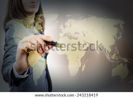 Close up of businesswoman drawing world map with pen