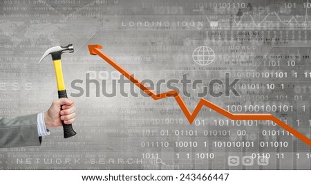 Close up of hammer in human hand breaking increasing graph