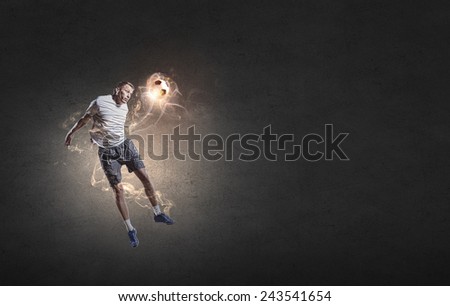 Football player in high jump taking ball