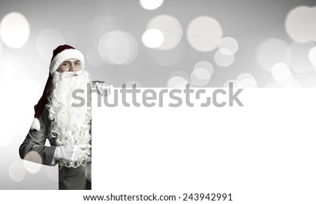 Businessman in santa hat with white blank banner