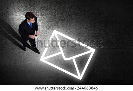 Top view of businessman looking at business sketches on floor