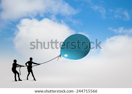Little silhouettes of people pulling rope with balloon
