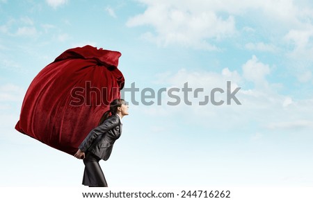 Businesswoman carrying big red bag on back