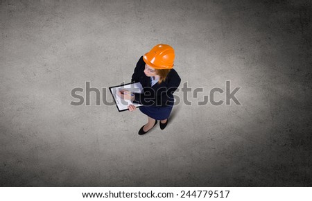 Top view of businesswoman looking at business sketches
