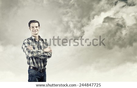 Young handsome man in casual thinking over something