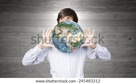 Young handsome man with disco plate in hands. Elements of this image are furnished by NASA