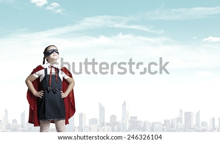 Girl of school age in super hero costume