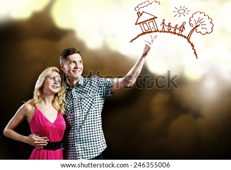 Young happy couple dreaming about family and future life