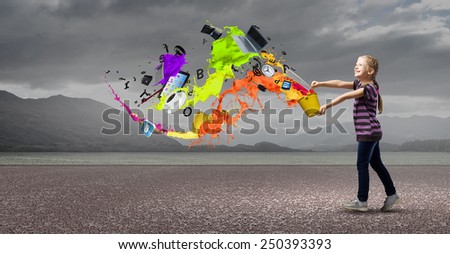 Cute girl with bucket and colorful springs coming out
