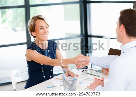 Business woman shaking hands with someone