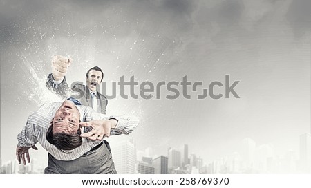 Two furious businessman fighting with each other