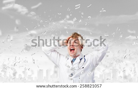 Young frustrated crazy doctor screaming very emotionally