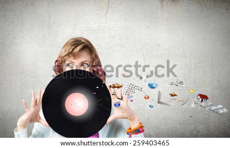 Young woman in casual holding disco plate