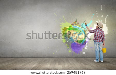 Boy of school age with yellow bucket and paint brush. Elements of this image are furnished by NASA