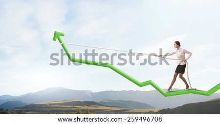 Businesswoman pulling arrow with rope and making it raise up
