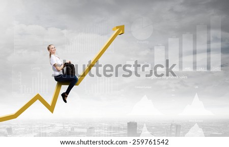 Young businesswoman riding graph arrow going up