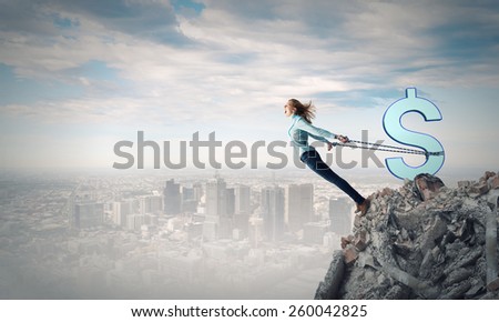 Young girl with ropes on hands trying to fly