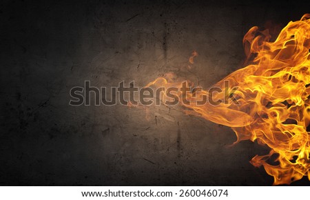 Conceptual image of burning fire on dark background