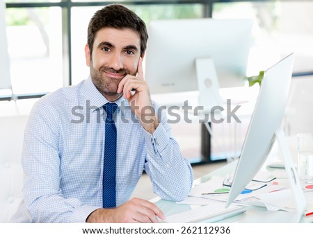 Handsome businessman sitting in office