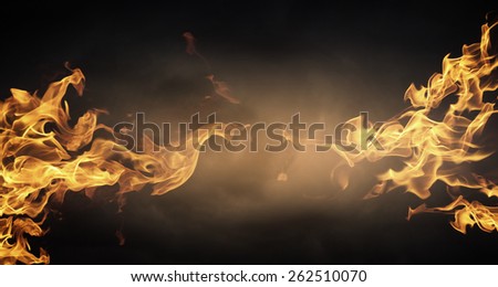 Conceptual image of burning fire on dark background
