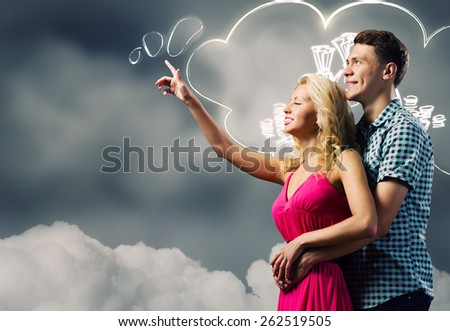 Young happy couple dreaming about future life