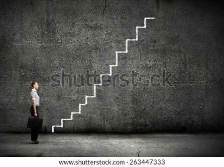 Businesswoman stepping ladder drawn by hand with chalk