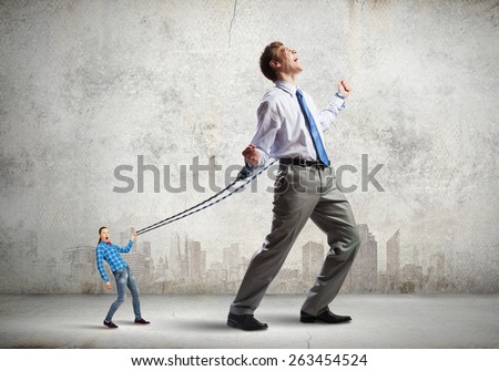 Young man on lead of woman trying to escape
