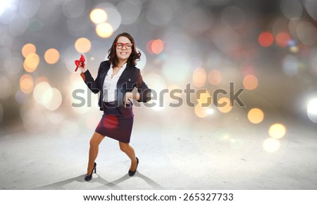 Young funny woman in suit against bokeh background