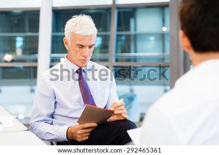 Two businessmen during interview in office