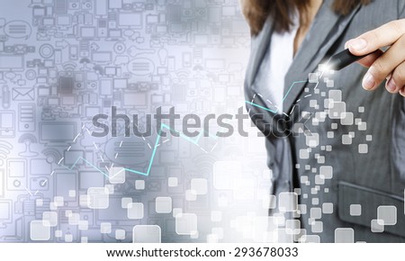 Close up of businesswoman drawing increasing graph with marker