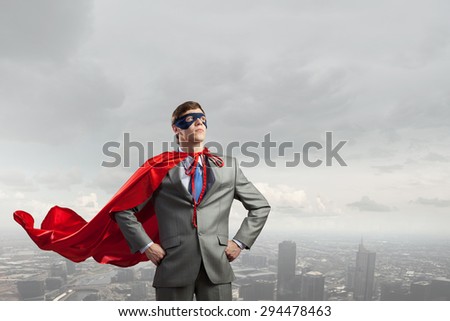 Young man in superhero costume representing power and courage