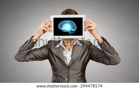 Woman holding tablet pc with brain concept
