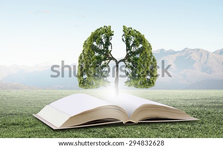 Concept of education and knowledge with tree growing from book