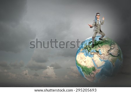 Cheerful young businessman with tie around head. Elements of this image are furnished by NASA