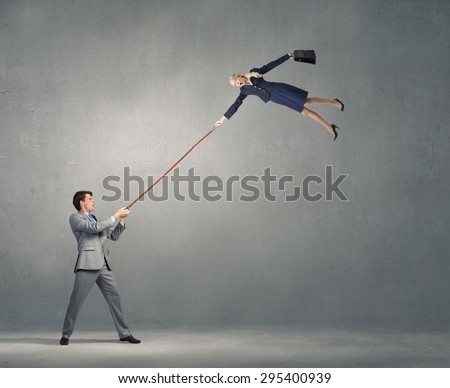 Young man on lead of colleague trying to escape