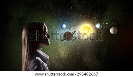 Cute girl of school age exploring space system