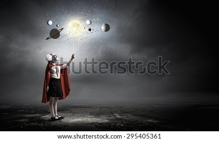 Cute girl of school age exploring space system