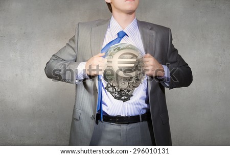 Young businessman acting like super hero of creativity