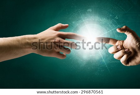 Close up of human hands reaching each other with fingers