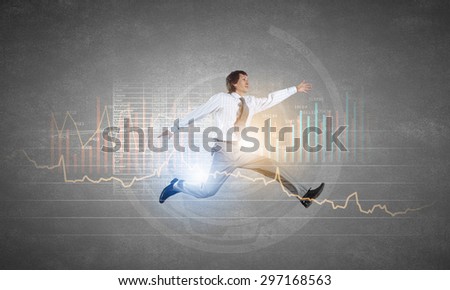 Young businessman in suit running in a hurry