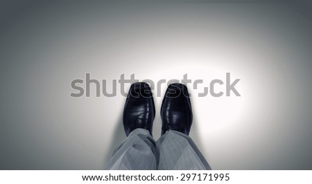 Top view of businessman legs choosing his way